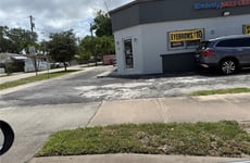 23571477