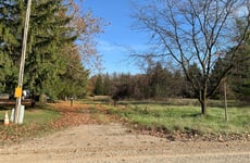 33647058