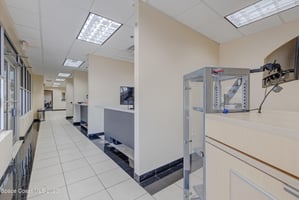 15570077