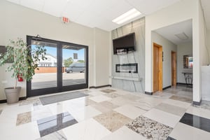 25690476