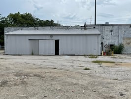 7671701